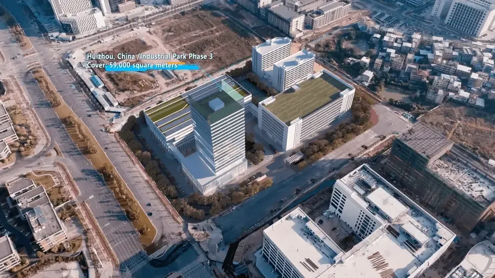Aerial view of BSJ's third industrial park in Huizhou, under a high-rise block.